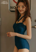 Midnight Riviera one-piece swimsuit in dark teal with V-neckline and thin adjustable straps
