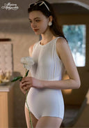 White one-piece swimsuit with pleated front and scoop back, side view