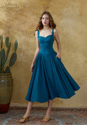 Blue linen suspender dress with square neckline and pleated mid-calf skirt