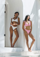 Pink and white bikini set with V-neck triangle tops and high-cut bottoms