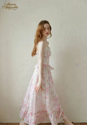 Light pink floral tiered dress with lace-trim bodice and spaghetti straps, ruffle hem