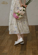 Floral tea dress with lace-edged hem and midi skirt length