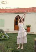 Parfum de Thé dress with tiered ruffle hem and pastel floral print, sleeveless