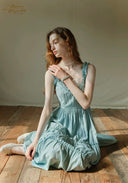 Light blue tiered midi dress with lace-trim neckline, ruffled straps, layered skirt tiers