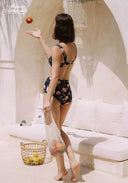 Floral high-waist bikini back view, black with pink floral print and narrow straps