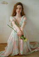 Pastel floral tiered dress with lace-trim square neckline and puff sleeves