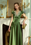 Green satin long dress with lace-trim V neckline, puff sleeves, and front decorative buttons