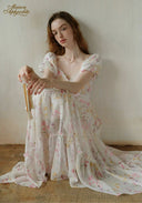Floral tiered maxi dress detail with puff sleeves and cinched waist, square neckline