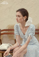 Blue floral V-neck dress with puff sleeves and drawstring waist