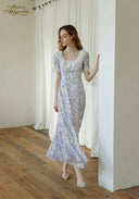 Lavender floral midi dress with square neckline and short puff sleeves, side view.