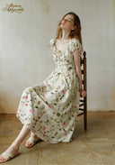 Floral midi dress with short puff sleeves and full skirt, round neckline, white base