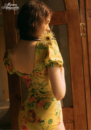 Yellow floral-print one-piece swimsuit with open back and puff sleeves