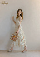 Floral sleeveless midi dress with tiered skirt and gathered waist, sleeveless bodice and round neck