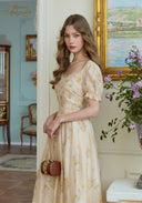 Cream floral puff sleeve dress with sweetheart neckline and ruched bodice