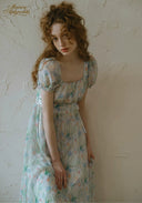 Light blue floral dress with square neckline and puff sleeves, ruched waist, side