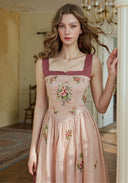 Pink linen maxi dress with burgundy straps and floral embroidery bodice