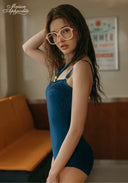 Midnight Riviera one-piece swimsuit in dark teal with V-neck and fitted midsection