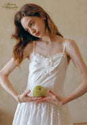 White spaghetti-strap dress with lace appliques and soft gathered waist skirt
