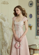 Pink lace midi dress with square neckline, cap sleeves, fitted bodice and flared skirt