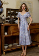 Light blue floral midi dress with puff sleeves and lace-trim square neckline, full length