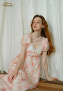 Sunset dress with light pink floral print, puff sleeves, square neckline, tiered skirt
