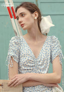 Blue Celeste floral dress with V-neck and ruched bodice, short tassel sleeves