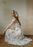 Secret Garden dress in white with floral print, tiered maxi skirt; side profile
