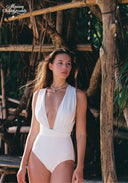 Ivory one-piece swimsuit with deep V neckline and ruched bodice