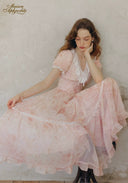 Rose pink tiered flounce dress with lace V-neck and short sleeves, side view