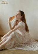 Floral tiered maxi dress with puff sleeves and ruffled tiers, cinched waist