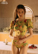 Yellow floral-print one-piece swimsuit with puff sleeves and tied waist detail