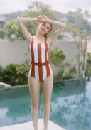Orange and white striped halter one-piece swimsuit with ruched waist