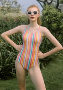 Rainbow-striped high-neck one-piece swimsuit, standing front view
