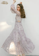 Lilac floral midi dress with long puff sleeves and flowing tiered skirt