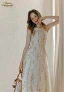 Floral sleeveless midi dress with round neckline and layered gathered skirt, all-over small blooms