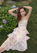 Parfum de Thé dress with layered ruffles and pastel floral print, mid-calf length