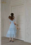 Light blue lace tiered midi dress with puff sleeves, square neckline and gathered waist.