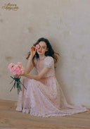 Light pink lace tea dress with puff sleeves and ruffled, tiered skirt