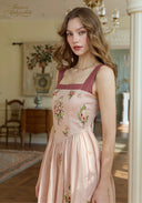 Pink linen maxi dress with burgundy straps and scattered floral embroidery pattern