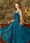 Blue linen suspender dress with square neckline and full gathered skirt, sleeveless