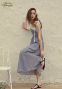 Blue patterned midi dress with square lace neckline and ribbon straps, flowing hem