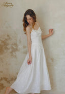 White tiered midi dress with lace trim at bust and spaghetti straps