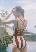 Orange and white striped halter one-piece swimsuit with crisscross tie-back