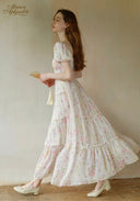 Floral tiered midi dress with short puff sleeves, tiered skirt, cinched waist