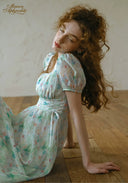 Light blue floral voile dress with square neckline, puff sleeves, gathered waist