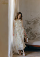 Floral sleeveless midi dress with softly gathered waist and tiered skirt, round neckline