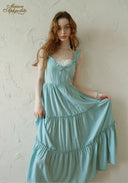 Light blue tiered midi dress with lace-trim neckline, ruffled straps, gathered skirt tiers