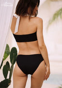 Rear view of black contrast bikini set with white straps and tied halter back