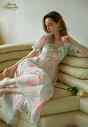 Pastel floral maxi dress with lace-trim bodice and layered tiered skirt