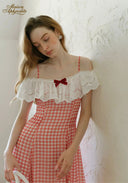 Three-quarter view of gingham plaid off-shoulder maxi dress with white lace neckline